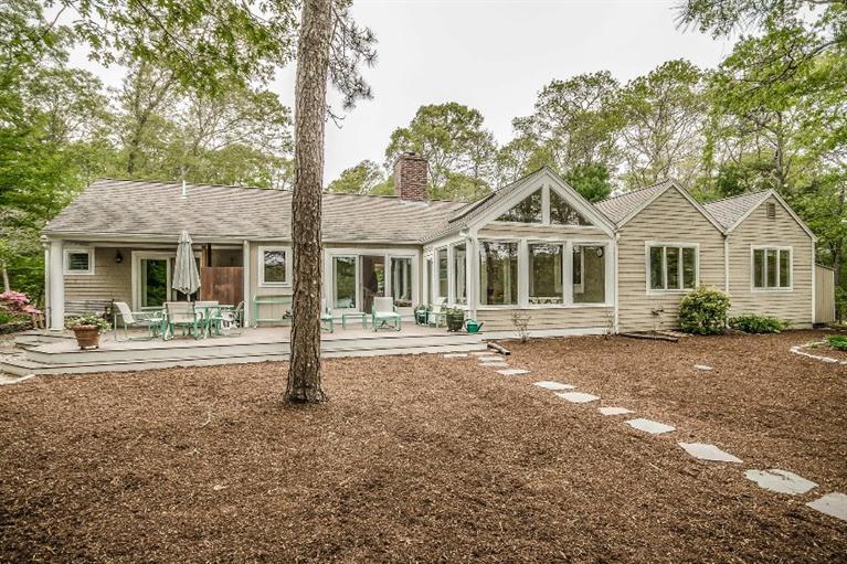70 Fells Pond Road Mashpee, MA 02649 - Photo 29 of 34 a front view of a house with porch and garden
