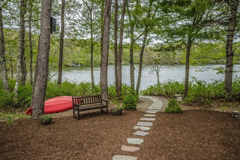 70 Fells Pond Road Mashpee, MA 02649 - Photo 31 of 34 a bench sitting in middle of a park