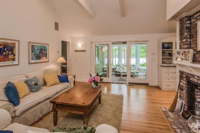 70 Fells Pond Road Mashpee, MA 02649 - Photo 8 of 34 a living room with furniture and a fireplace