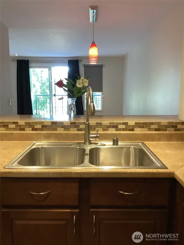 a kitchen with a sink and a window