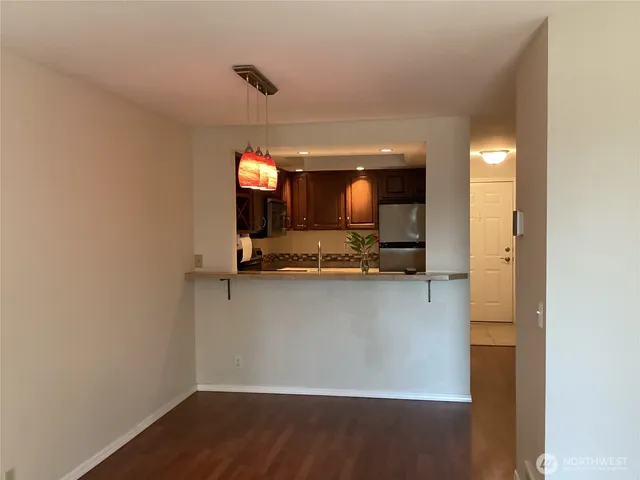 a view of a living room with hardwood floor