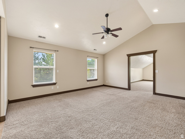 1279 West 1500th Street North Mapleton, UT 84664 - Photo 39 of 83 Spacious room featuring vaulted ceilings, neutral-toned walls, and plush carpet flooring