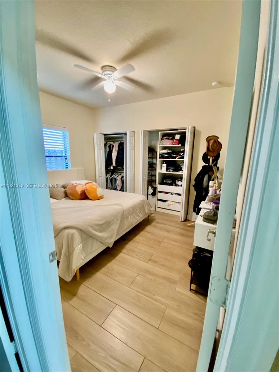 4318 Southwest 164th Court Miami, FL 33185 - Photo 13 of 27 a bedroom with furniture and a flat screen tv