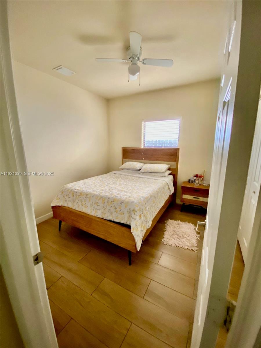 4318 Southwest 164th Court Miami, FL 33185 - Photo 16 of 27 a bedroom with a bed and a window