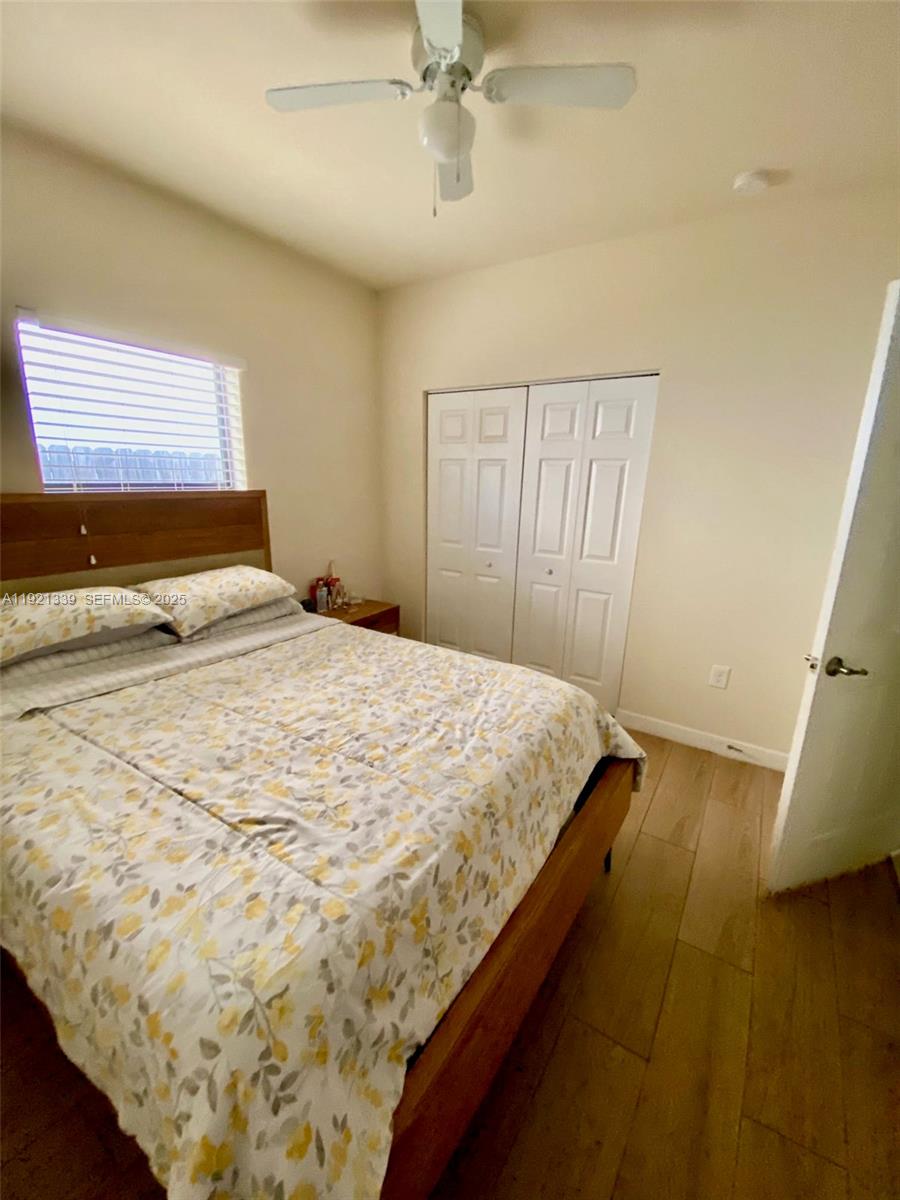 4318 Southwest 164th Court Miami, FL 33185 - Photo 17 of 27 a bedroom with a bed and window