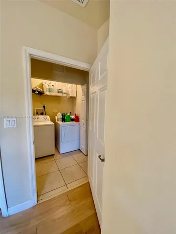 a living room with a couch and a large window