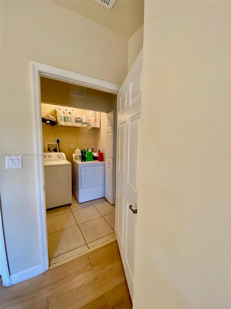4318 Southwest 164th Court Miami, FL 33185 - Photo 24 of 27 a living room with a couch and a large window