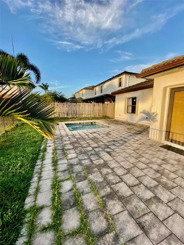 a house view with a backyard space