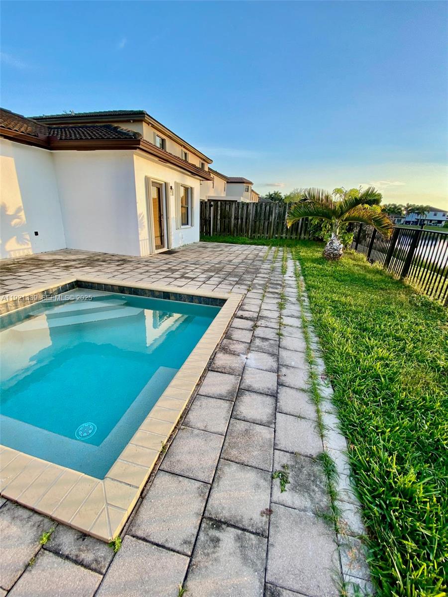 4318 Southwest 164th Court Miami, FL 33185 - Photo 26 of 27 a view of a house with a yard