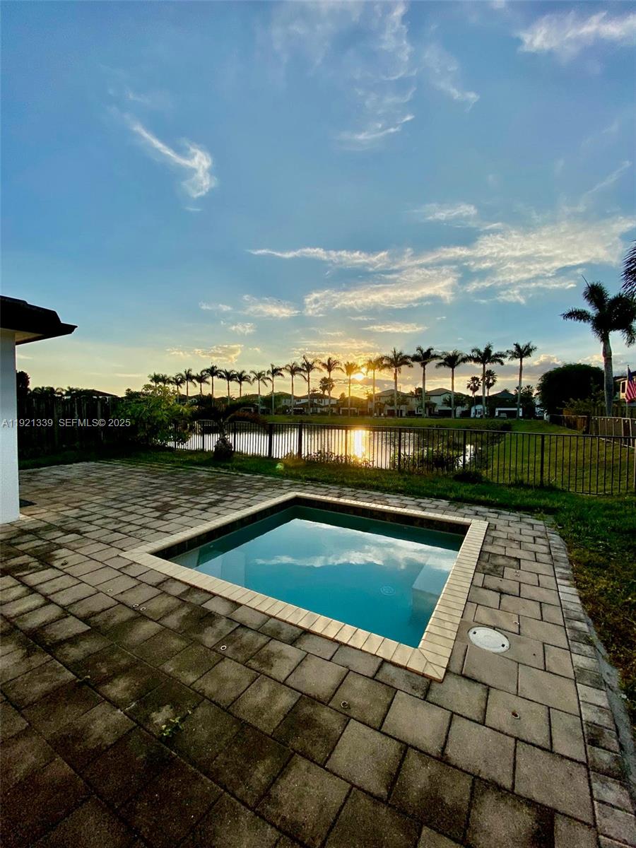 4318 Southwest 164th Court Miami, FL 33185 - Photo 27 of 27 a view of swimming pool with outdoor seating and yard in back