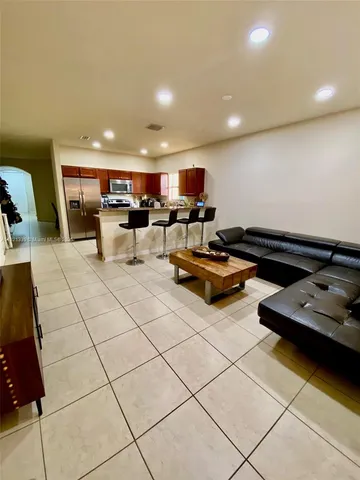 a living room with lots of furniture and a table