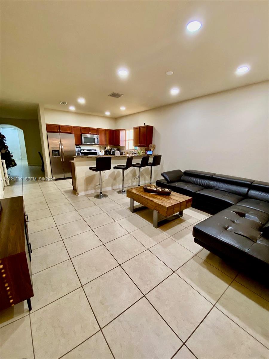 4318 Southwest 164th Court Miami, FL 33185 - Photo 4 of 27 a living room with lots of furniture and a table