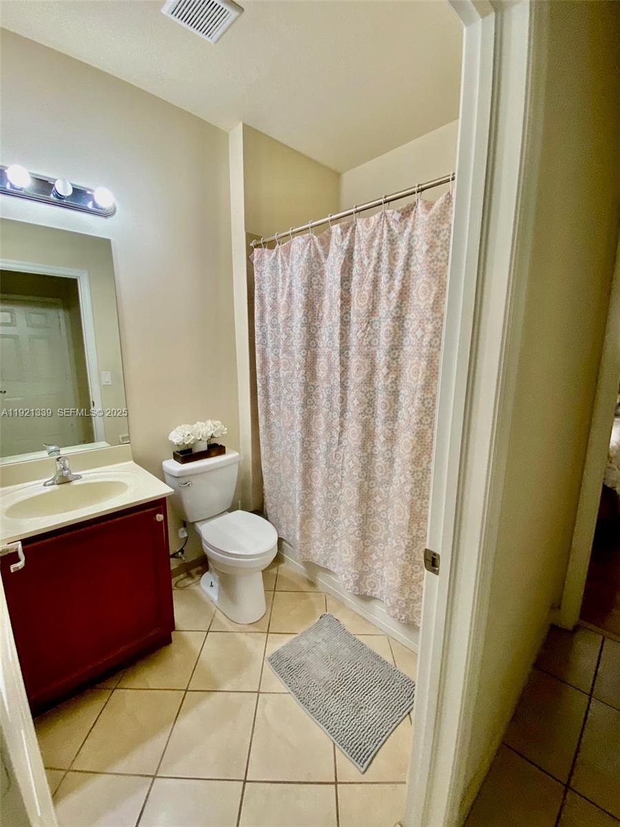 4318 Southwest 164th Court Miami, FL 33185 - Photo 7 of 27 a bathroom with a sink toilet and shower