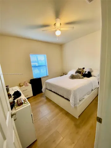 a bedroom with a bed and dresser