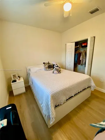 a bedroom with a bed and dresser