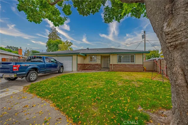 a view of a car parked in front of a house