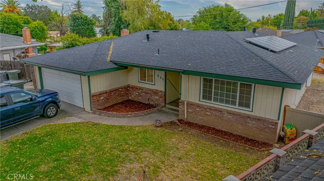 a view of house with backyard porch and outdoor seating