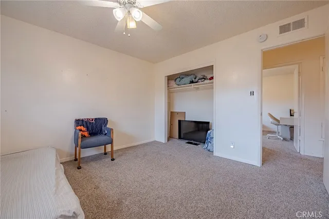 a view of an empty room and workspace