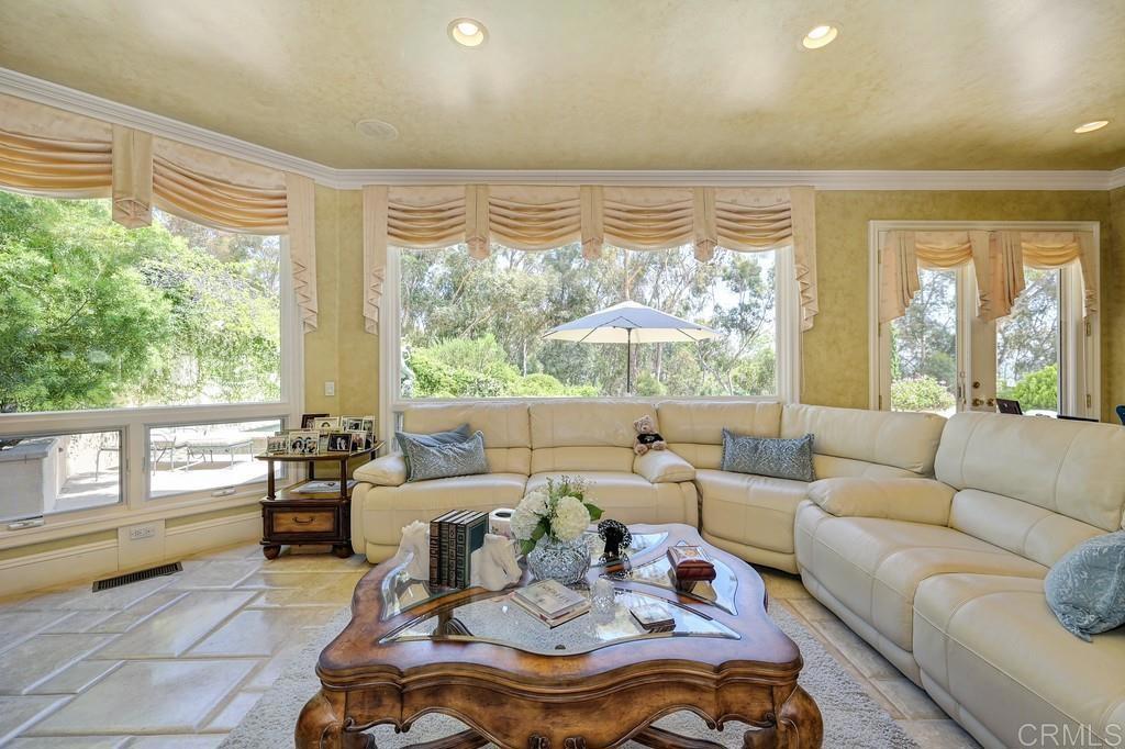 7210 Aviara Drive Carlsbad, CA 92011 - Photo 12 of 63 a living room with furniture and a large window