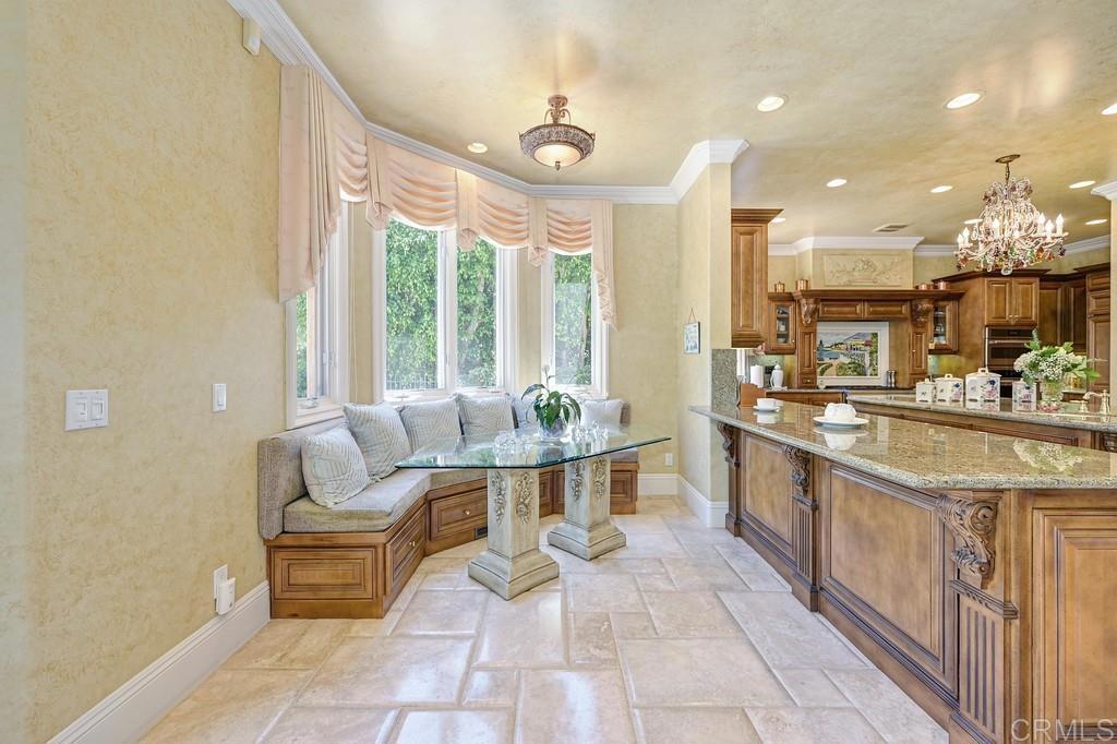 7210 Aviara Drive Carlsbad, CA 92011 - Photo 15 of 63 a large white kitchen with a large window
