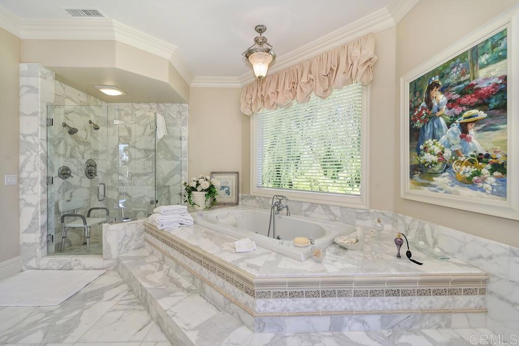 7210 Aviara Drive Carlsbad, CA 92011 - Photo 39 of 63 a bath tub sitting next to a bathroom and a shower