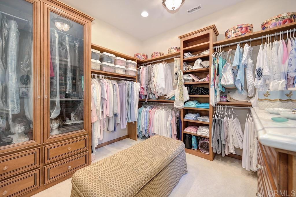 7210 Aviara Drive Carlsbad, CA 92011 - Photo 40 of 63 a bedroom with a bed and a closet