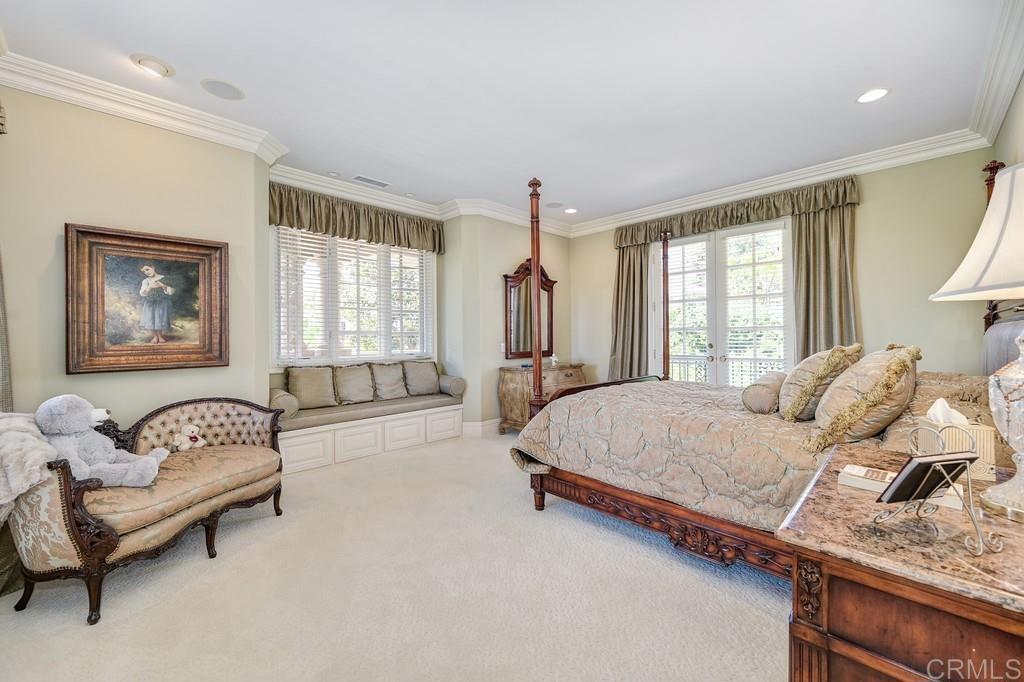7210 Aviara Drive Carlsbad, CA 92011 - Photo 41 of 63 a bedroom with a bed and a couch