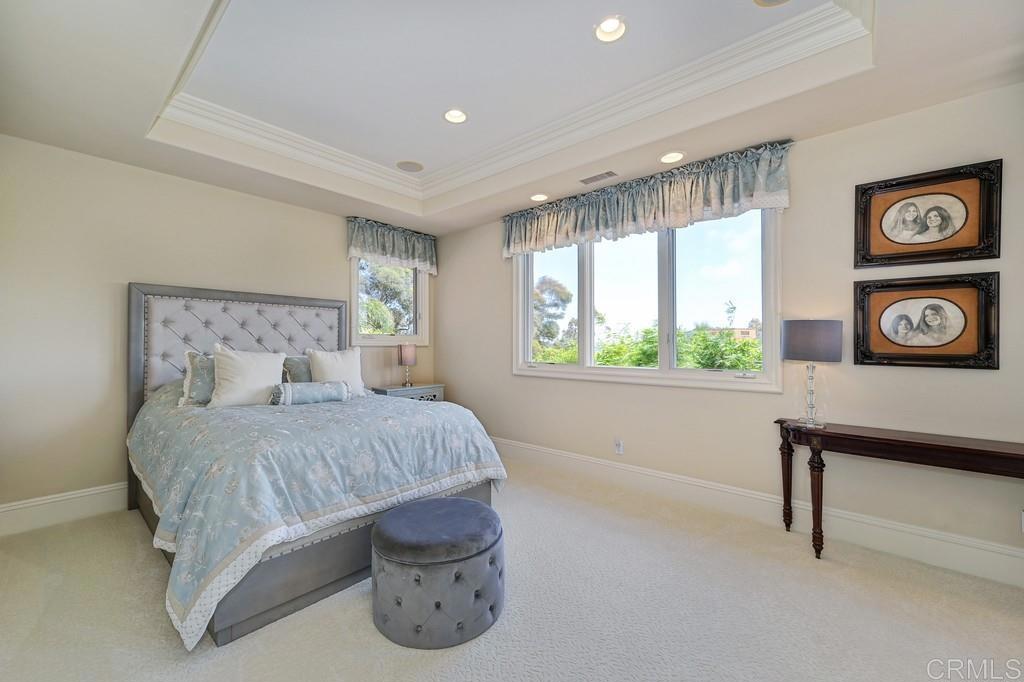 7210 Aviara Drive Carlsbad, CA 92011 - Photo 45 of 63 a bedroom with a bed and a window