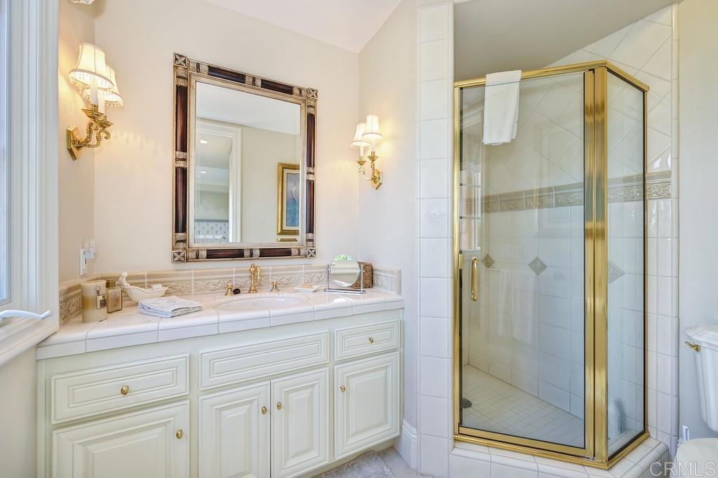 7210 Aviara Drive Carlsbad, CA 92011 - Photo 46 of 63 a bathroom with a double vanity sink mirror and double