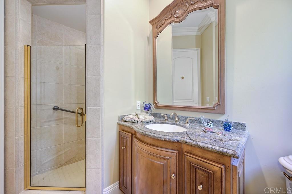 7210 Aviara Drive Carlsbad, CA 92011 - Photo 47 of 63 a bathroom with a sink and a mirror