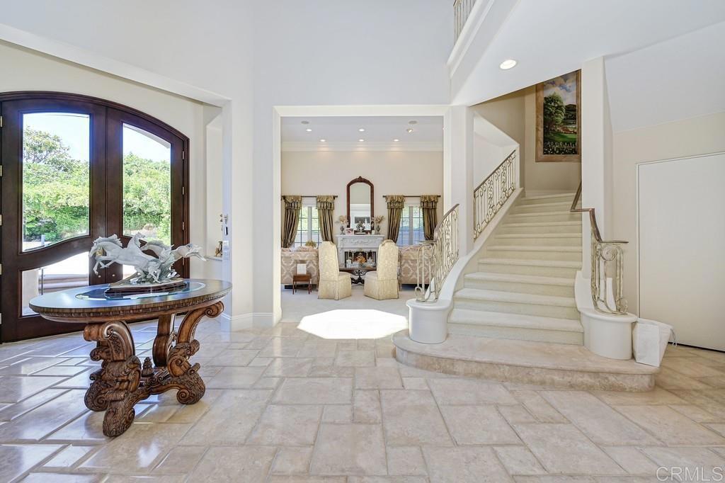 7210 Aviara Drive Carlsbad, CA 92011 - Photo 8 of 63 a living room with furniture and a floor to ceiling window