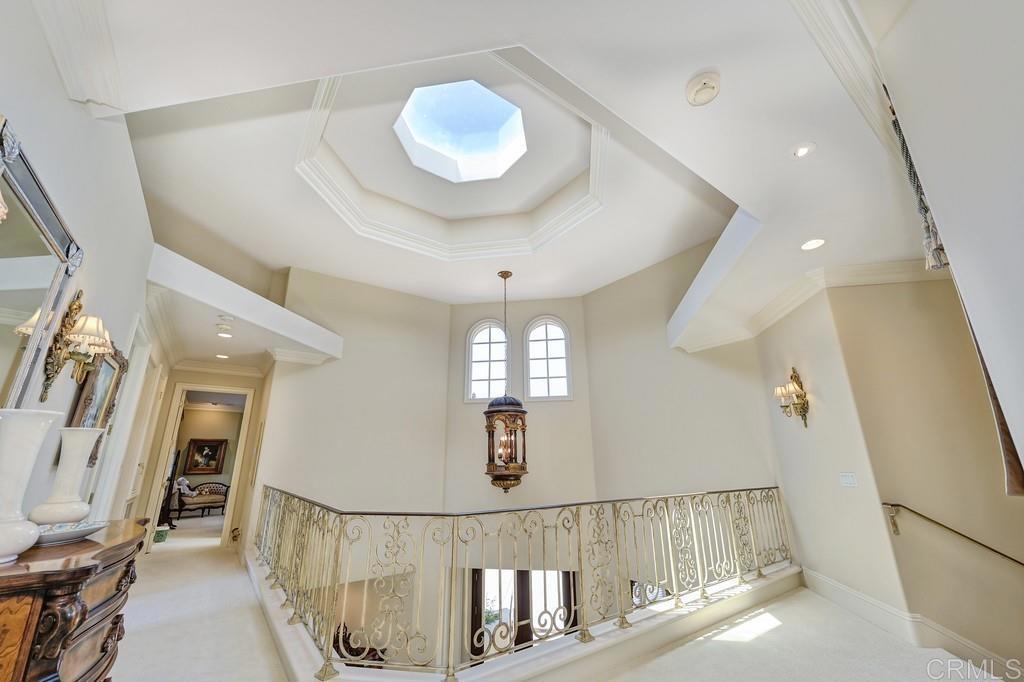 7210 Aviara Drive Carlsbad, CA 92011 - Photo 9 of 63 a view of a hallway with wooden floor and staircase