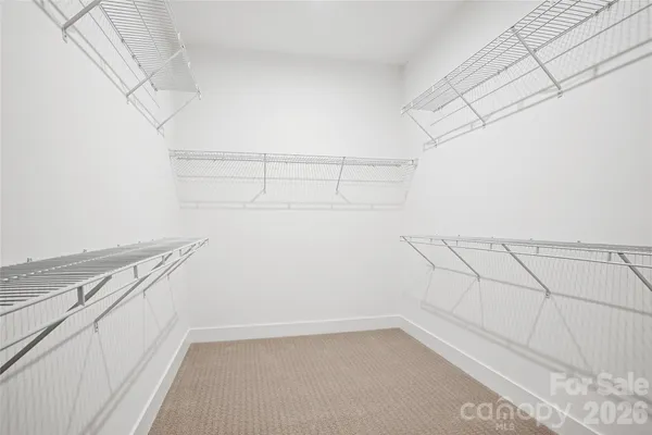 a view of a room with racks on the wall