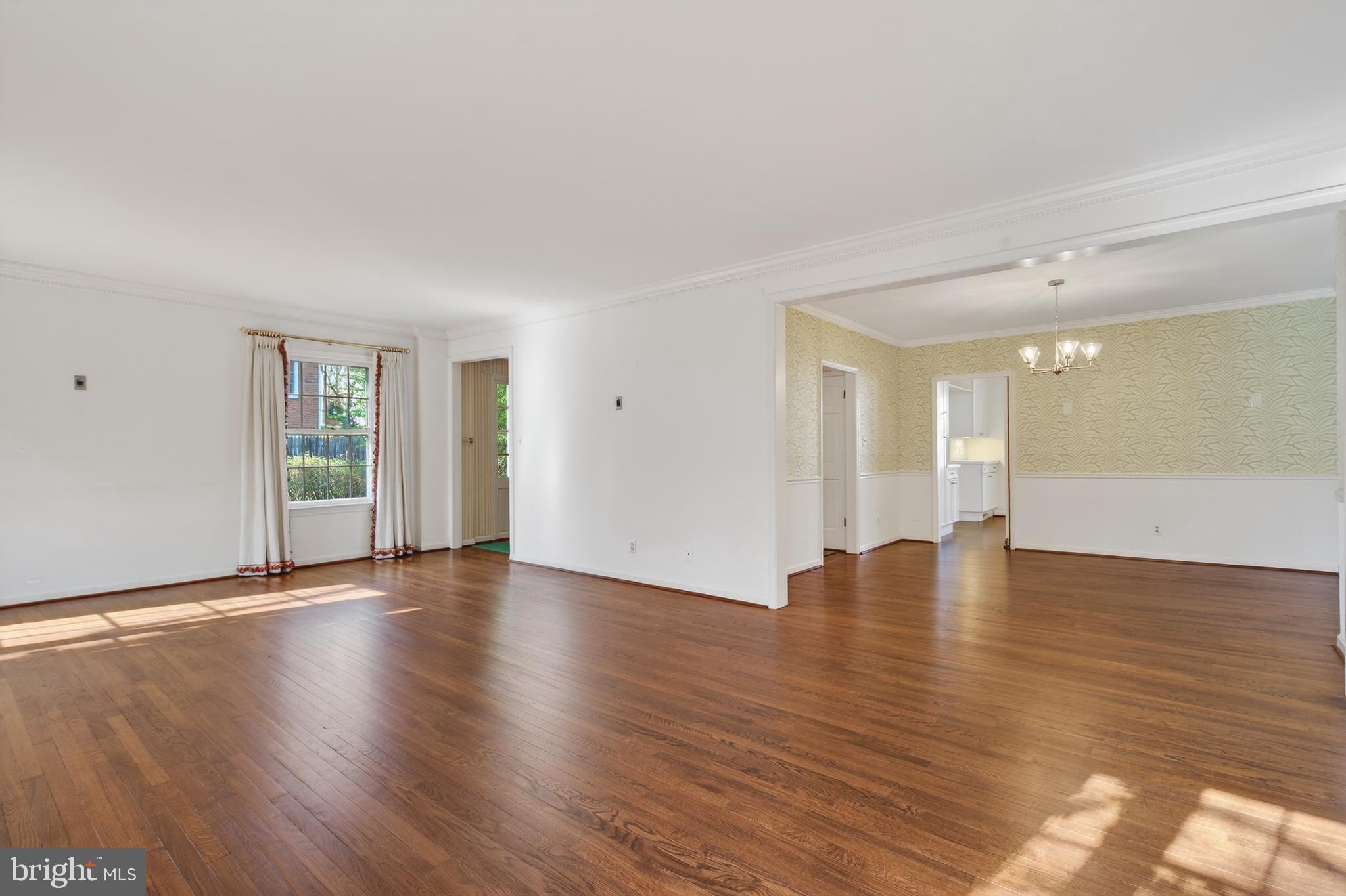 3512 Hamlet Place Chevy Chase, MD 20815 - Photo 12 of 51 a view of an empty room with wooden floor and a window