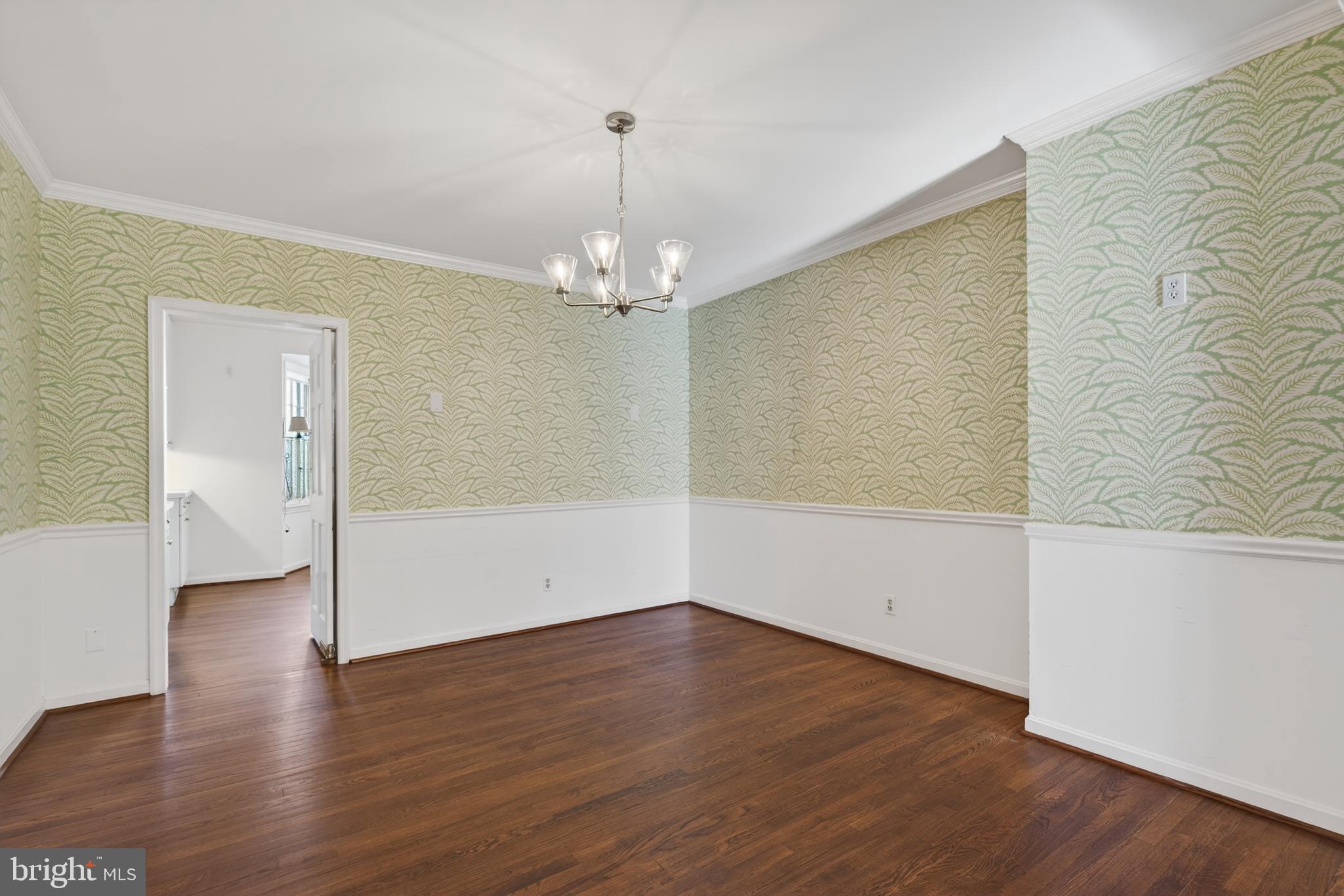 3512 Hamlet Place Chevy Chase, MD 20815 - Photo 14 of 51 wooden floor in an empty room with a window