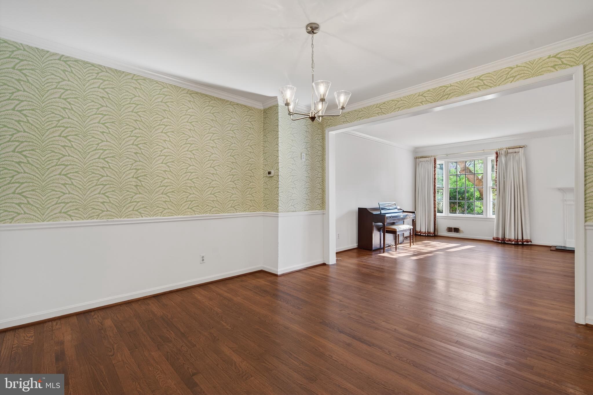 3512 Hamlet Place Chevy Chase, MD 20815 - Photo 15 of 51 a view of a livingroom with wooden floor and a ceiling fan