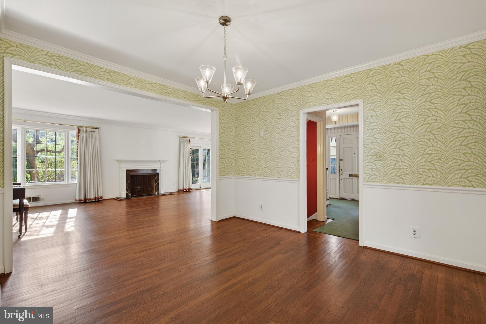 3512 Hamlet Place Chevy Chase, MD 20815 - Photo 16 of 51 a view of an empty room with wooden floor and a window