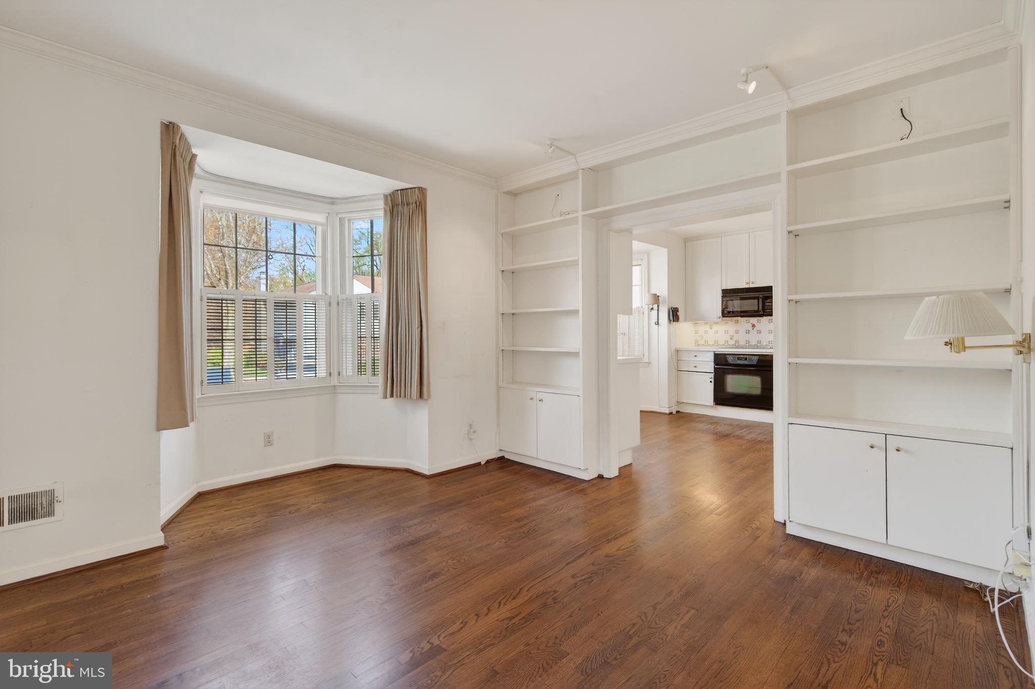 3512 Hamlet Place Chevy Chase, MD 20815 - Photo 21 of 51 a view of empty room with wooden floor and windows