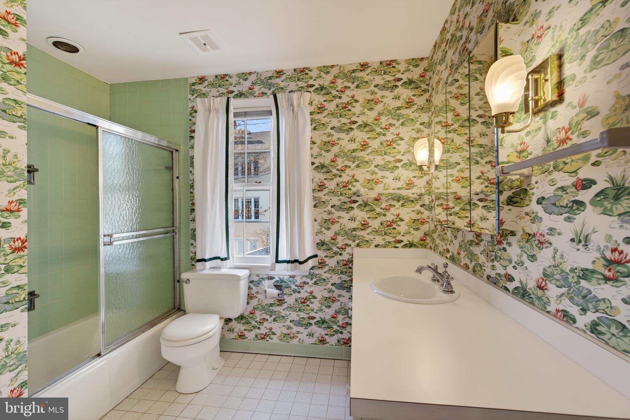 3512 Hamlet Place Chevy Chase, MD 20815 - Photo 35 of 51 a bathroom with a toilet sink and shower