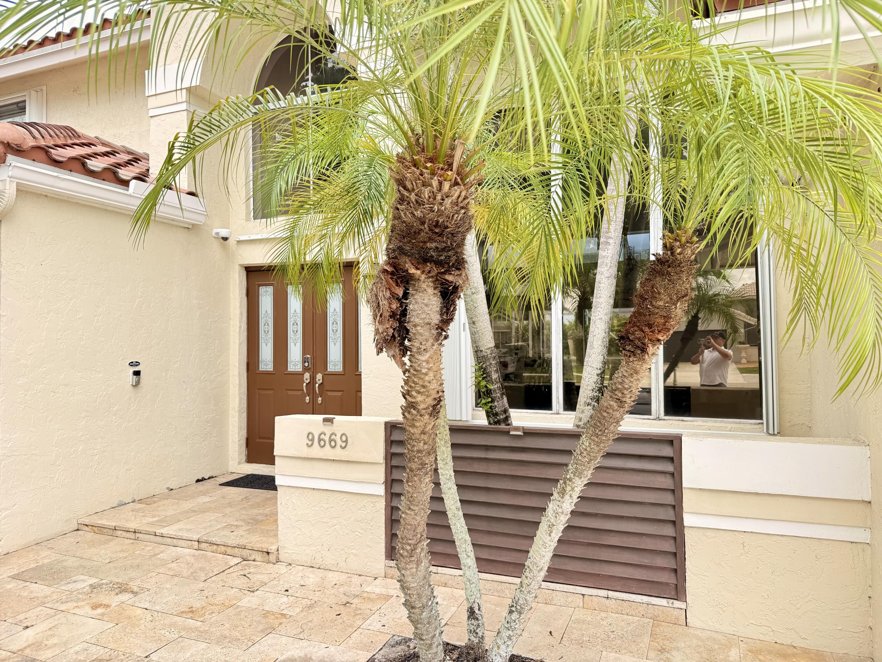 9669 Carousel Circle North Boca Raton, FL 33434 - Photo 1 of 22 a view of a brick building with many windows