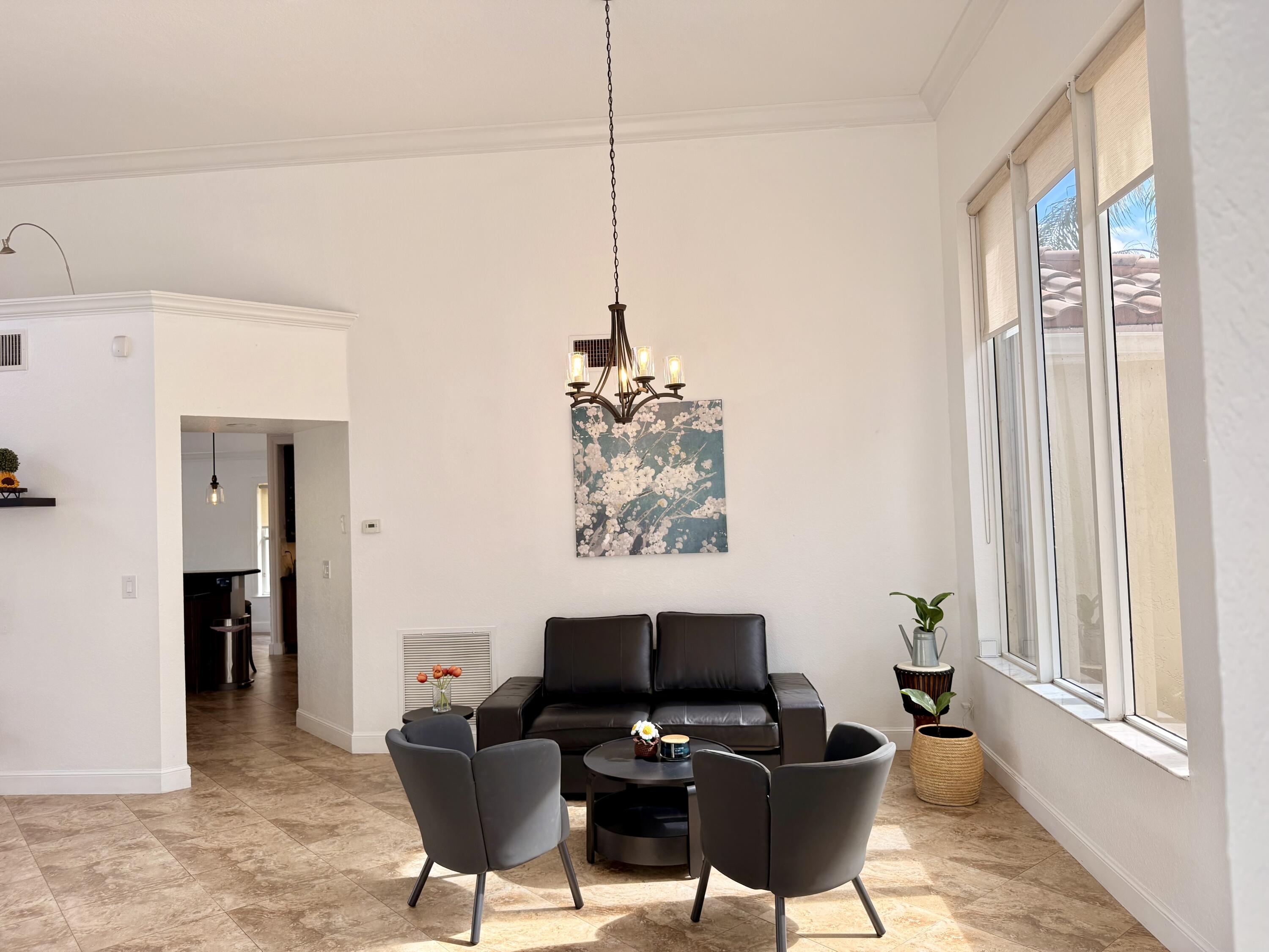 9669 Carousel Circle North Boca Raton, FL 33434 - Photo 11 of 22 a work room with furniture and a window