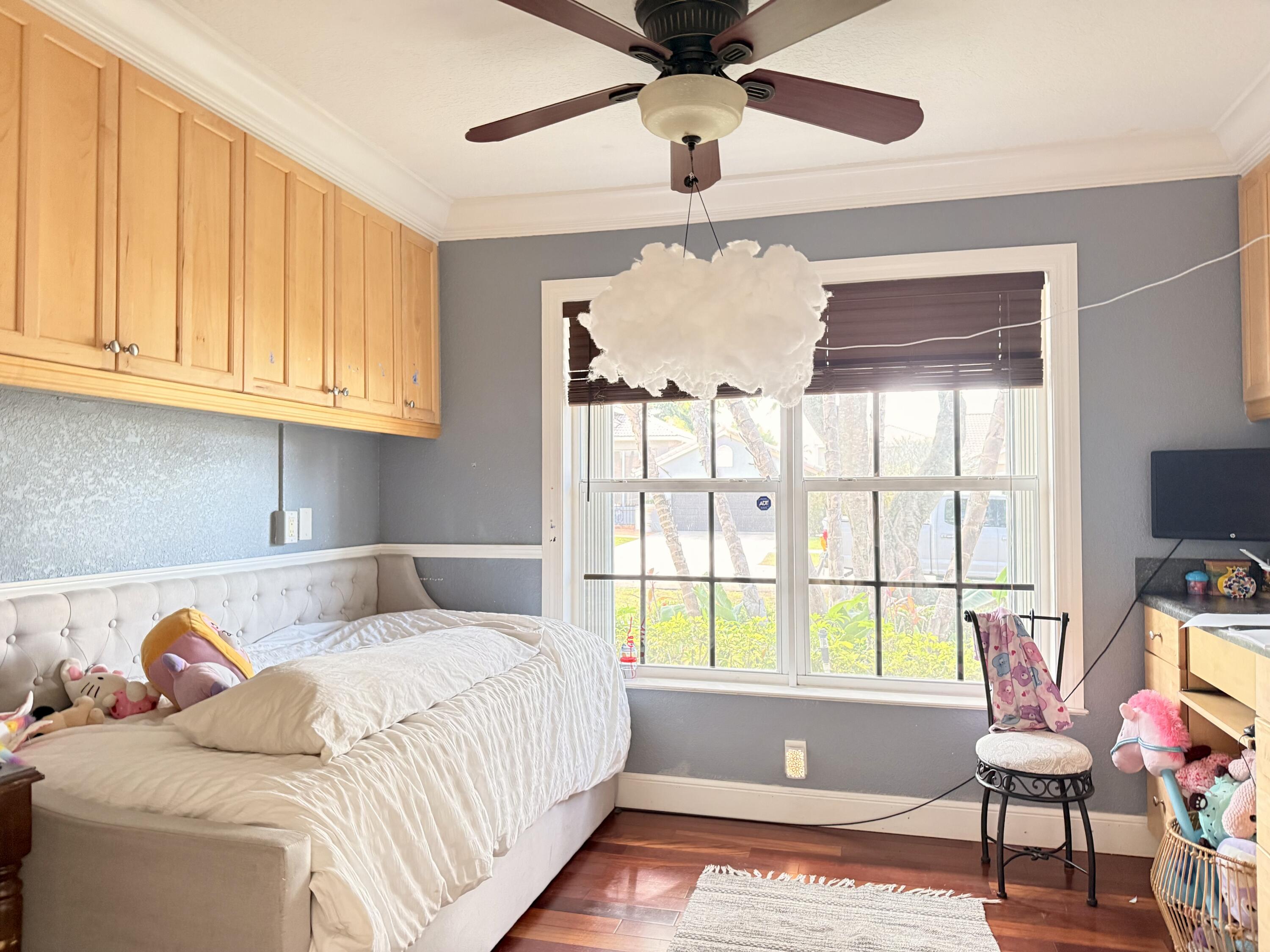 9669 Carousel Circle North Boca Raton, FL 33434 - Photo 12 of 22 a bedroom with a bed and a window