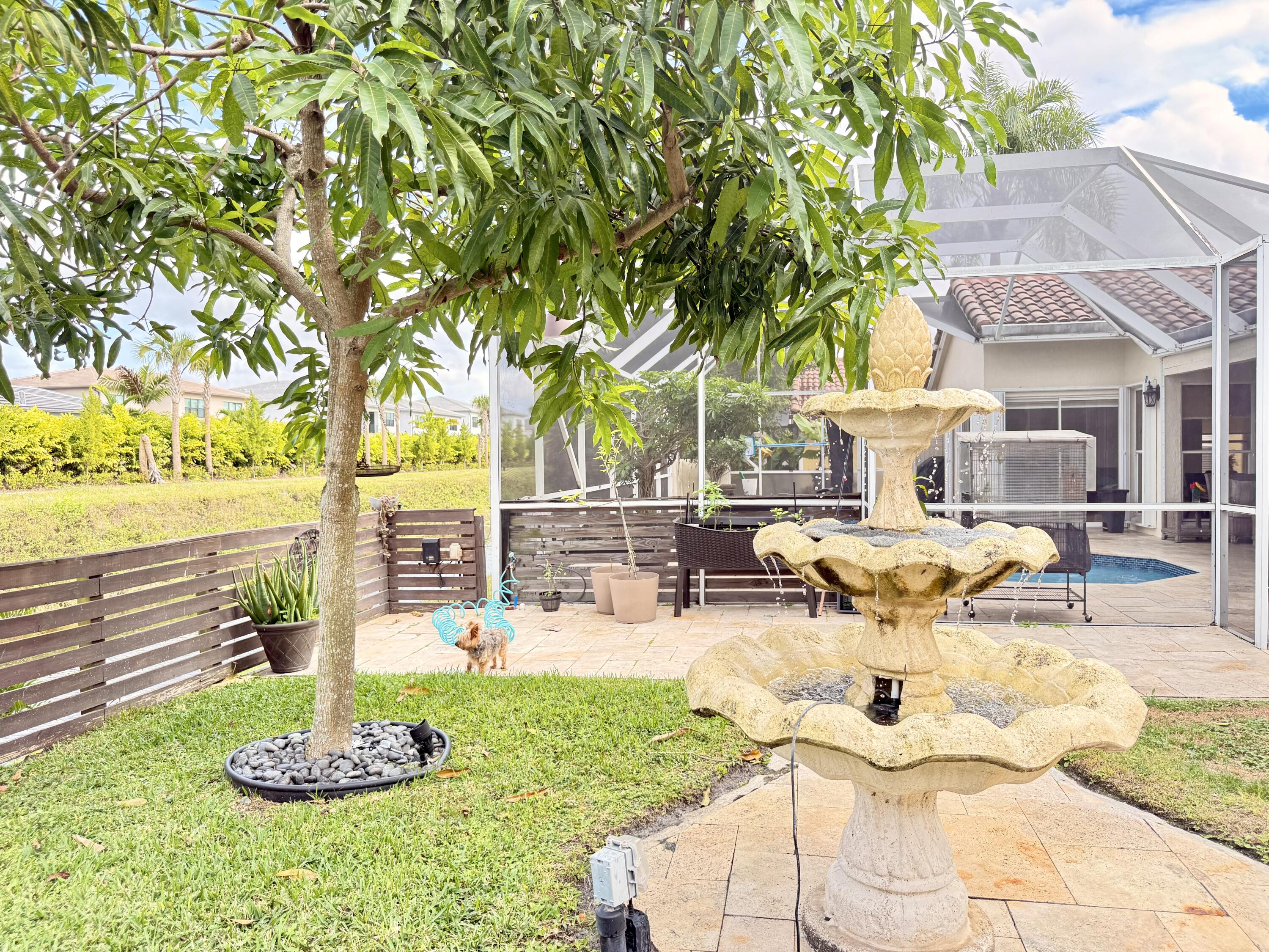 9669 Carousel Circle North Boca Raton, FL 33434 - Photo 7 of 22 a view of a swimming pool with a patio