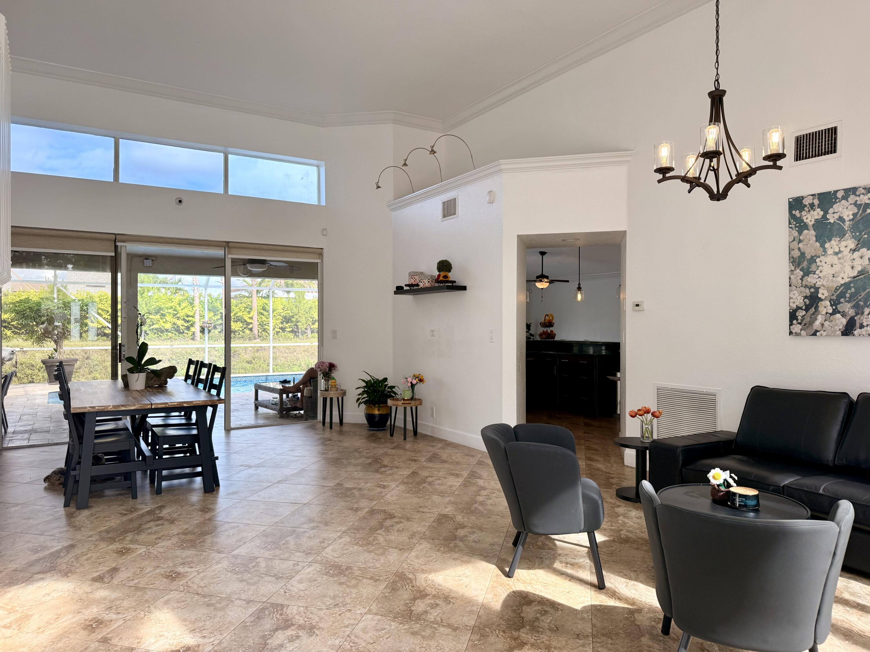 9669 Carousel Circle North Boca Raton, FL 33434 - Photo 10 of 22 a view of a dining room with furniture window and outside view