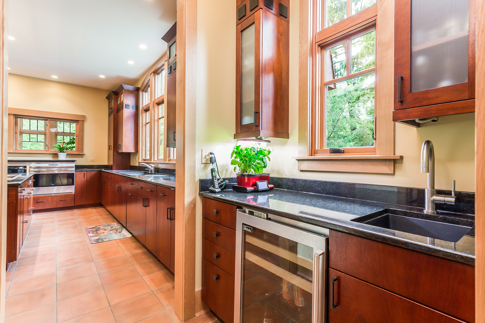 333 Longcommon Road Riverside, IL 60546 - Photo 11 of 50 a kitchen filled with a large window appliances and cabinets