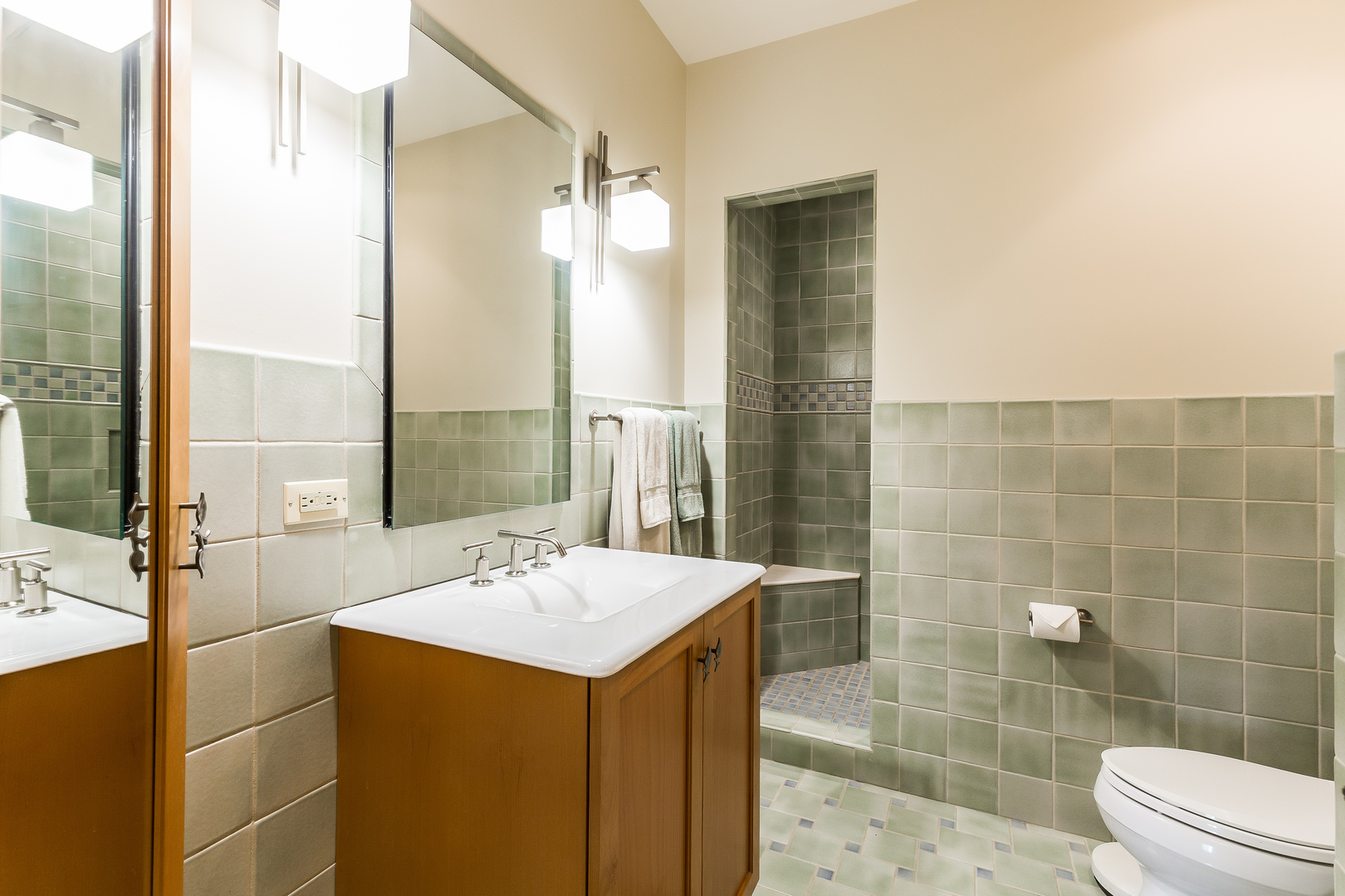 333 Longcommon Road Riverside, IL 60546 - Photo 30 of 50 a bathroom with a sink and mirror with toilet