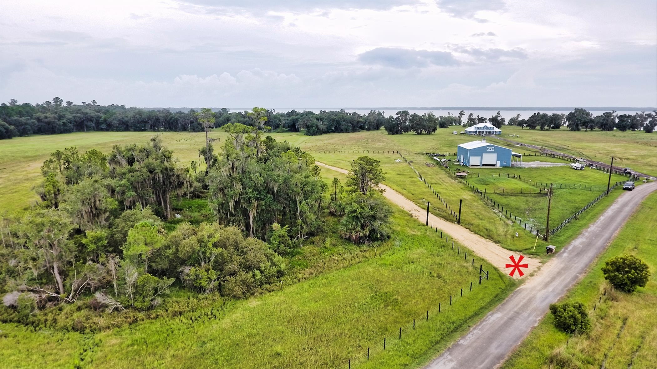 14435 Andalusia Trail Bunnell, FL 32110 - Photo 14 of 25 a view of a lake with houses in the back