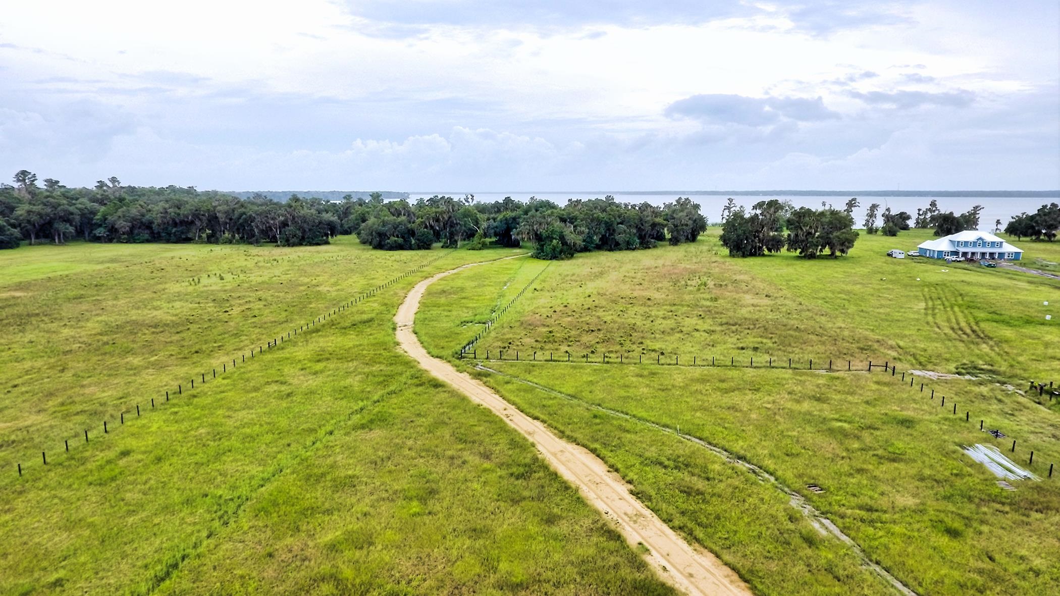 14435 Andalusia Trail Bunnell, FL 32110 - Photo 16 of 25 a view of a lake with a yard