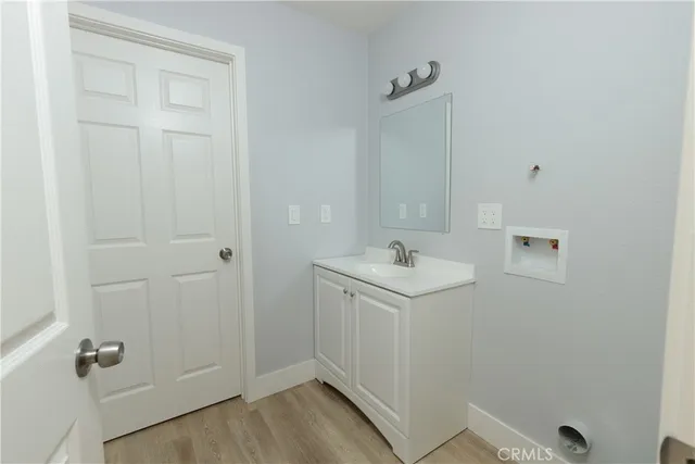 a bathroom with a sink and mirror