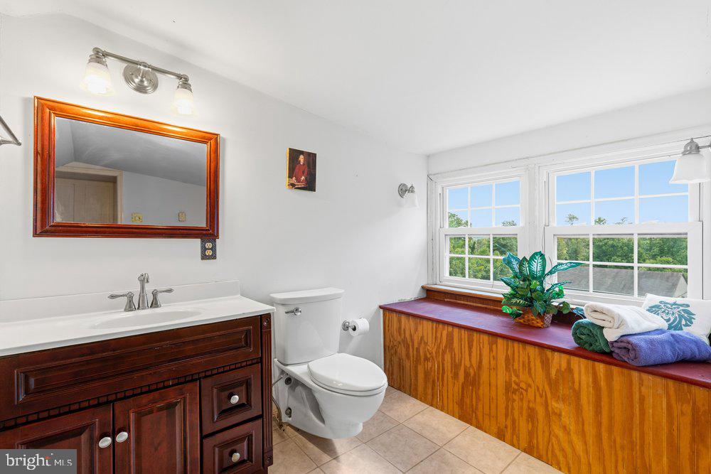 201 East Moyer Road Pottstown, PA 19464 - Photo 32 of 64 a bathroom with a toilet a sink and mirror